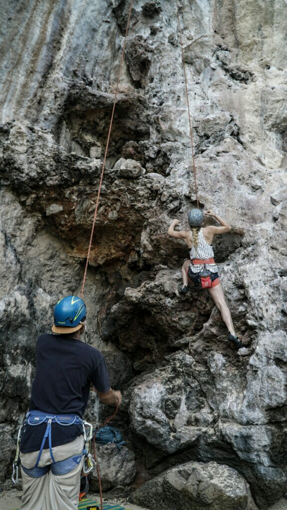 Rock climber with a spotter.