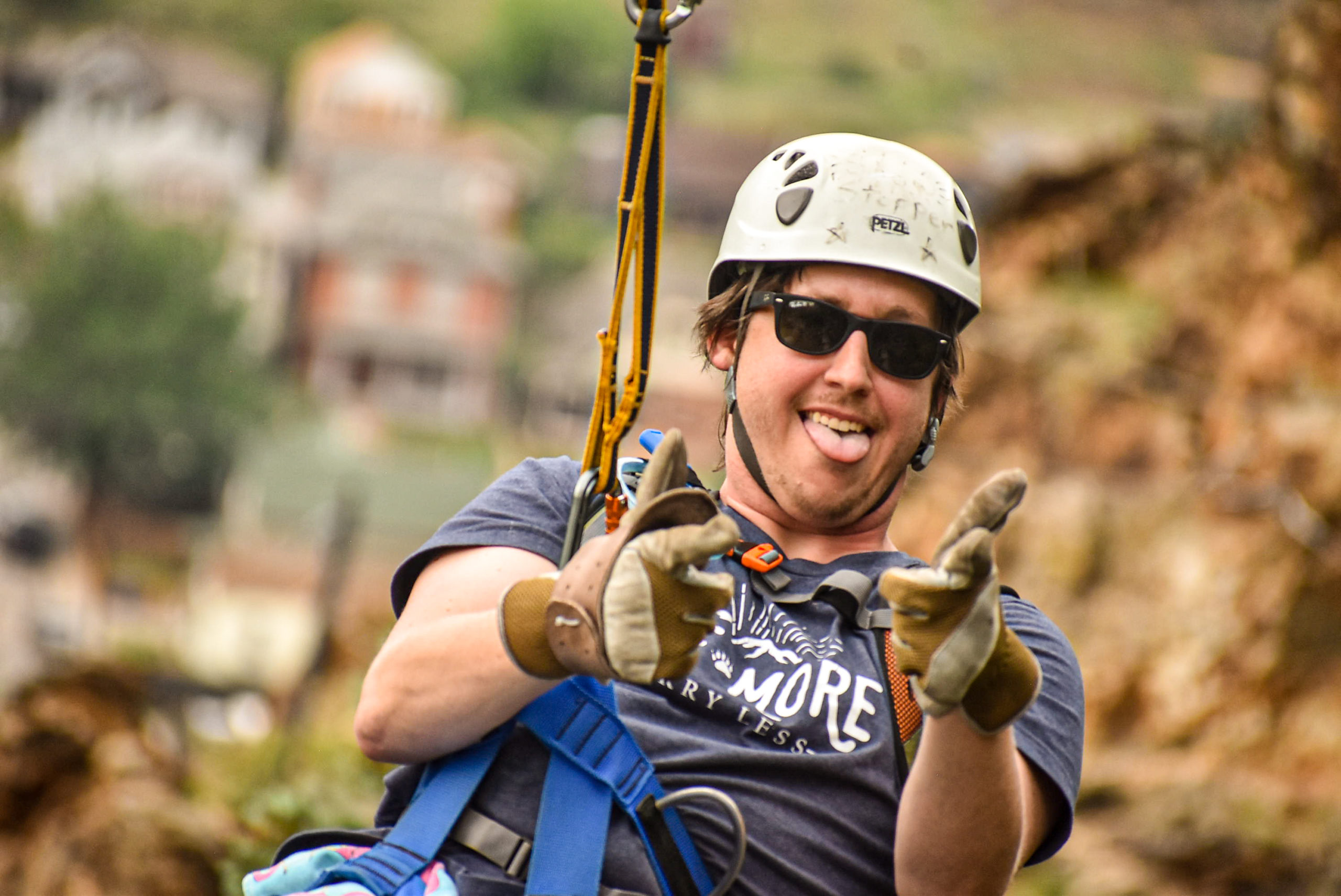 man posing while ziplining