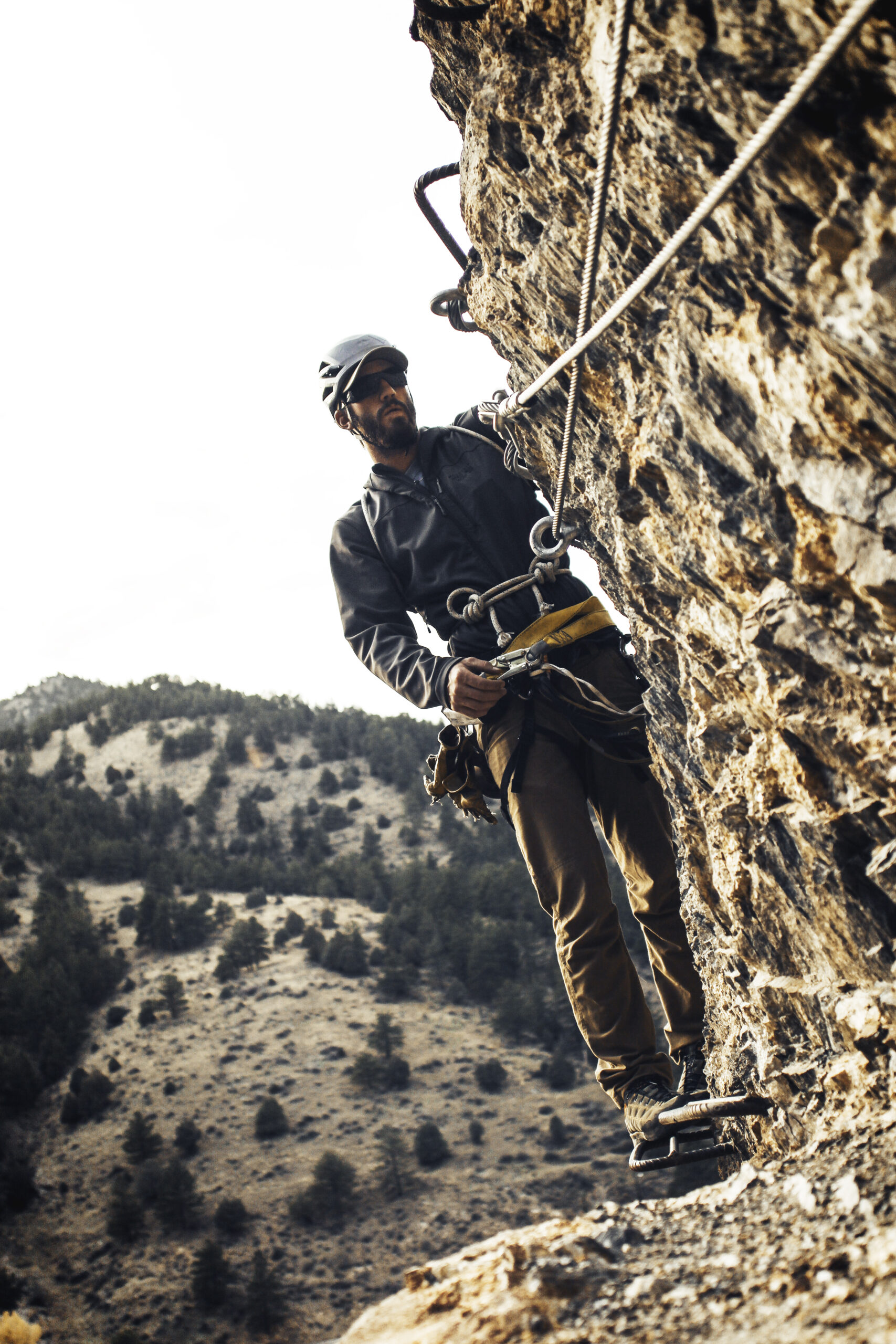 man on Via Ferrata, cliffside