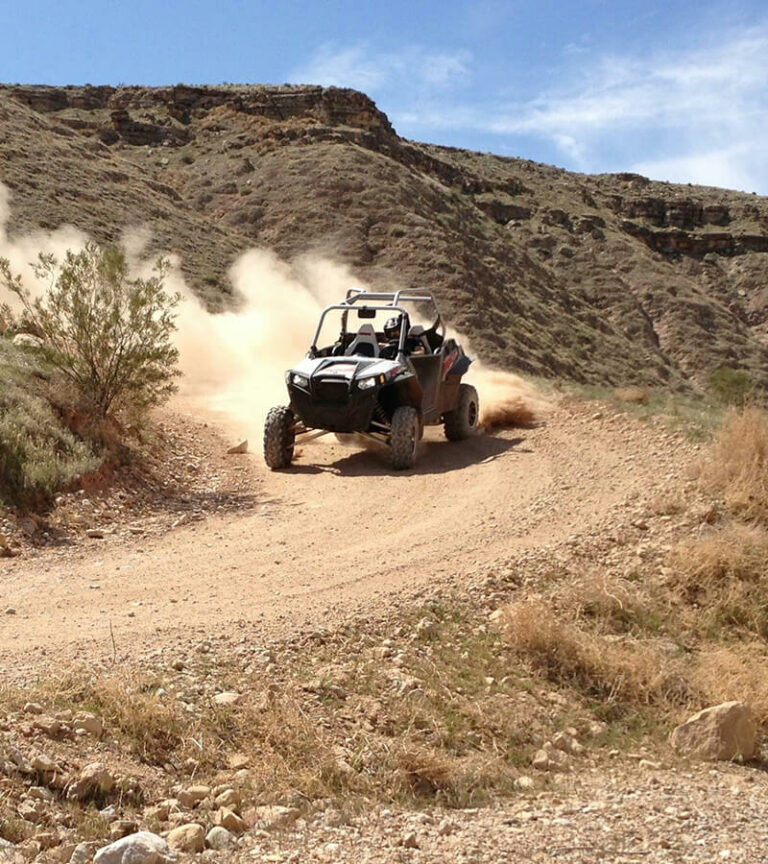 People driving a UTV on a half-day trip.