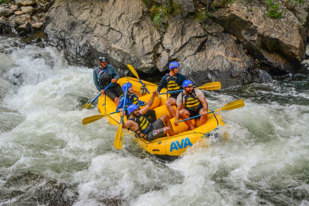 Guide and guests navigating river.