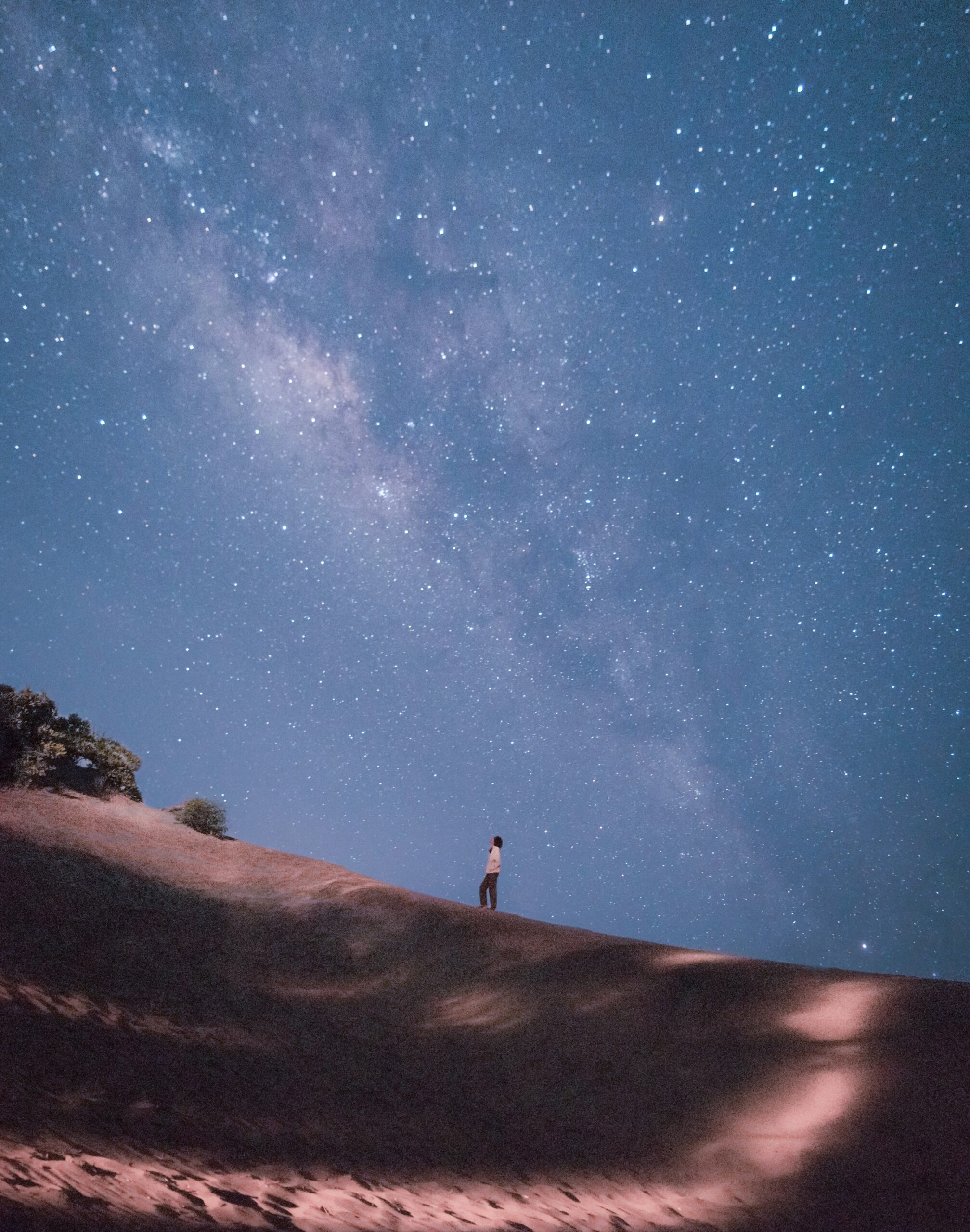 person stargazing on top of plateau